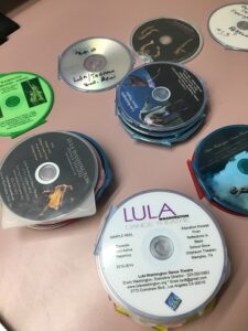 A number of CDs lying on a table