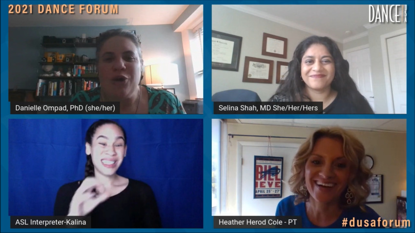 Screenshot of four individuals engaged in conversation