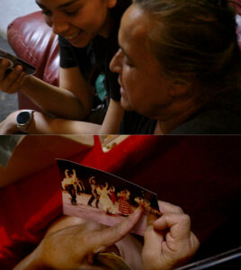 On top, two people talking and looking at something, on the bottom a hand pointing to a spot on a photograph of dancers